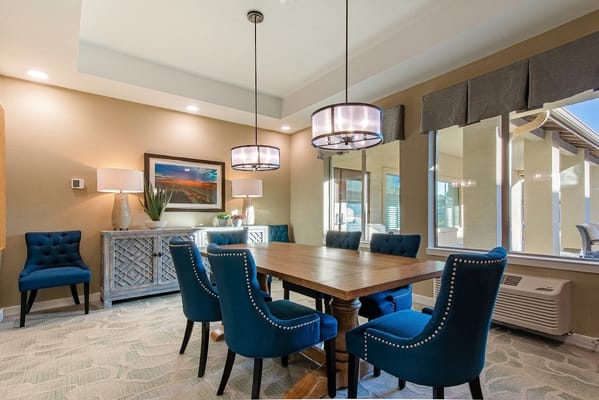 Bright common area with dining table and chairs