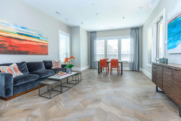 Bright lounge area with comfortable seating and artwork