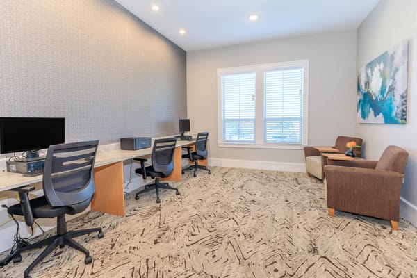 Interior of a common area with workstations and seating