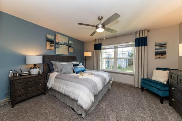 Cozy and well-decorated resident room with bed and décor