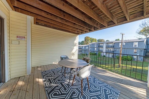 Outdoor seating area with table and chairs
