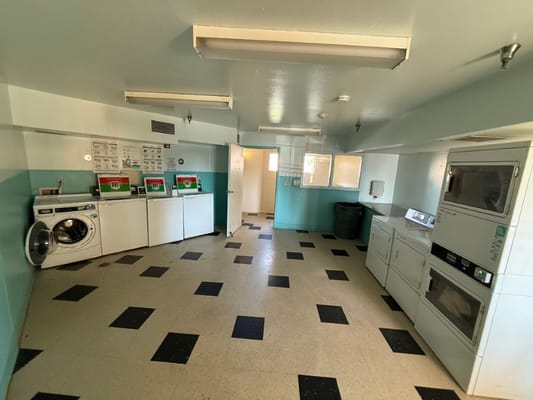 Laundry room with washing machines and dryers