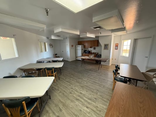 Interior view of a common area with tables and chairs