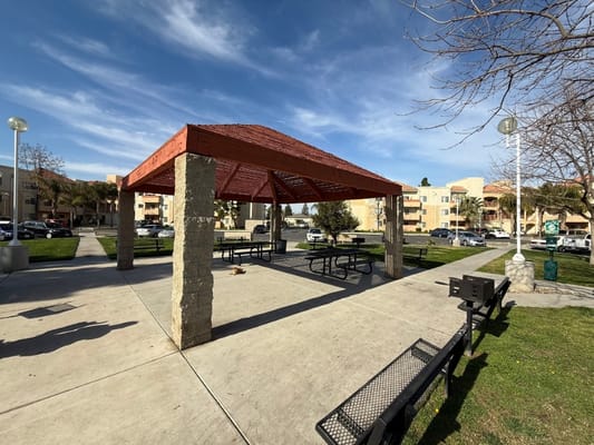 Outdoor pavilion area with picnic tables and seating