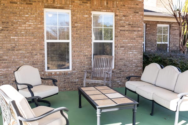Outdoor seating area with chairs and table