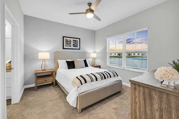 Brightly decorated resident bedroom with window view