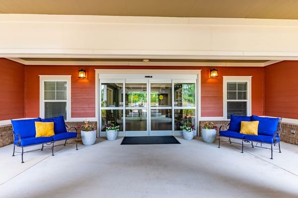 Exterior view of the lodge entrance with seating