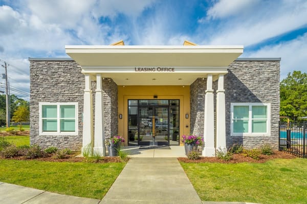 Front entrance of a leasing office with stone facade