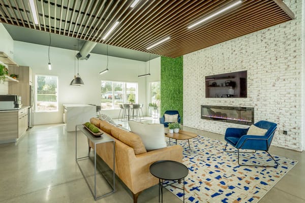 Modern lounge area with seating and green wall