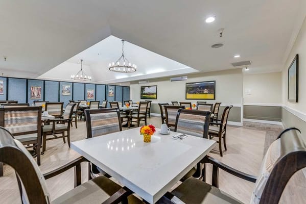 Dining room setup with tables and chairs
