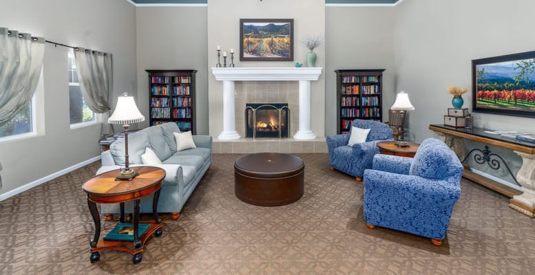 Cozy common area with comfortable seating and bookshelves
