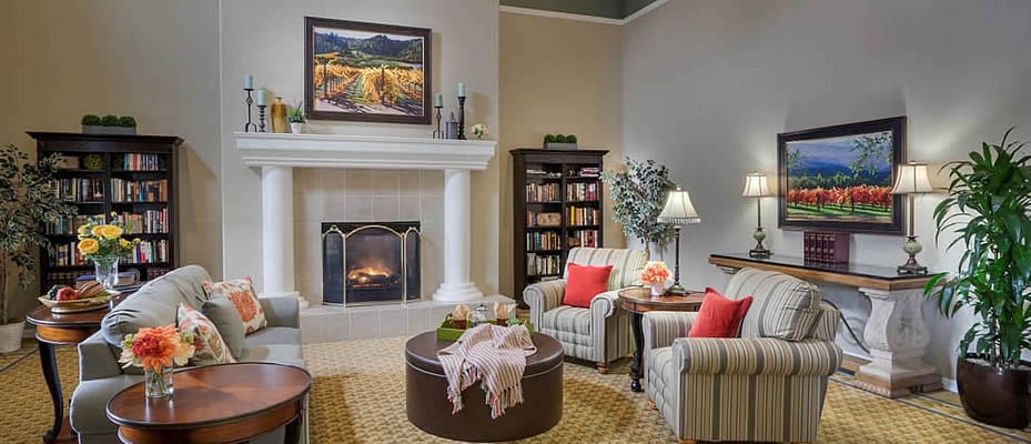 Common area with comfortable seating and bookshelves
