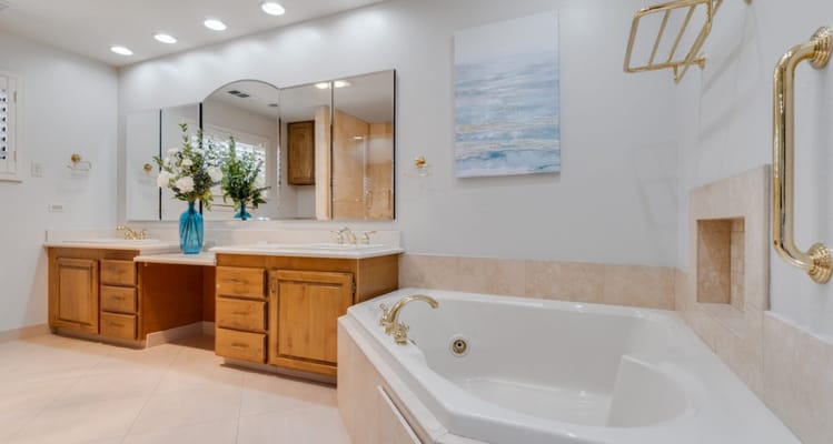 Modern bathroom with double sinks and a soaking tub