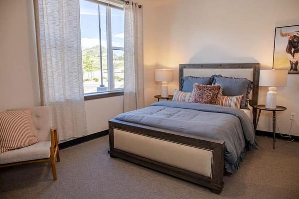 Cozy resident room with a bed and natural light
