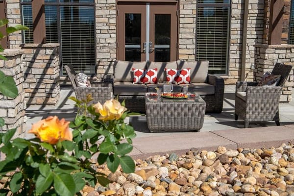 Outdoor seating area with decorative flowers