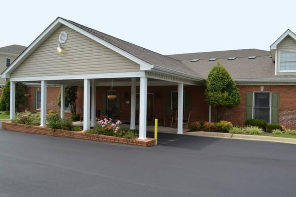 Exterior view of the building entrance with landscaping