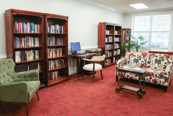 Cozy library area with bookshelves and seating