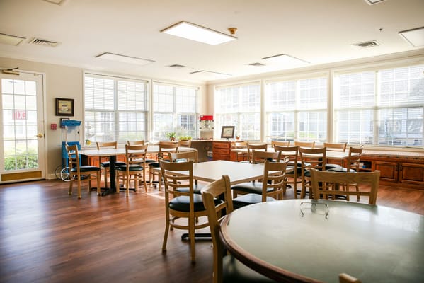 Bright dining area with seating and windows