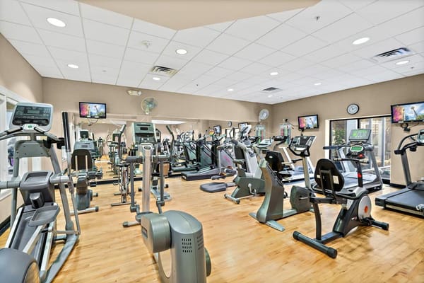 Well-equipped fitness room with various exercise machines