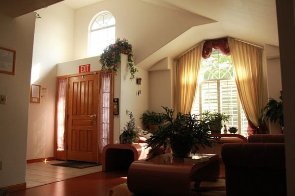 Bright and welcoming common area with plants and natural light