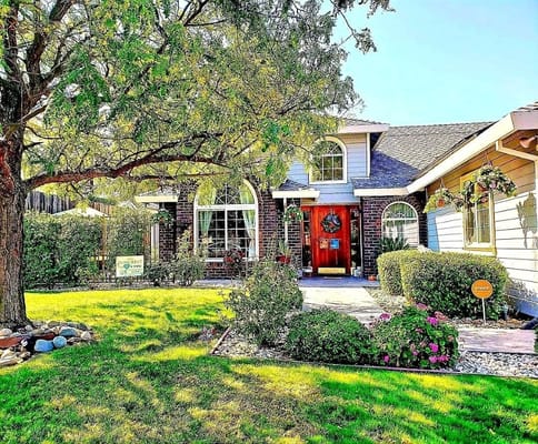 Exterior view of Montclair Villa surrounded by greenery