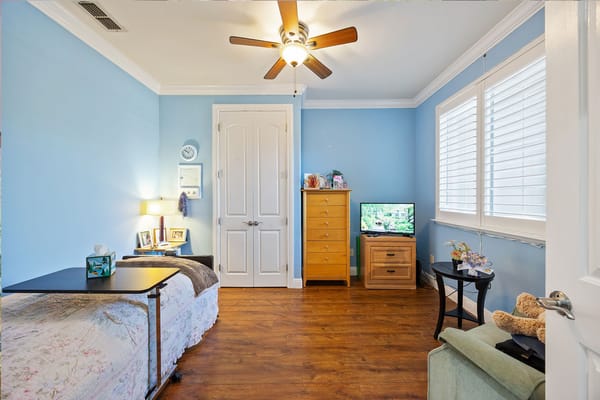 Cozy private resident room with furniture and TV