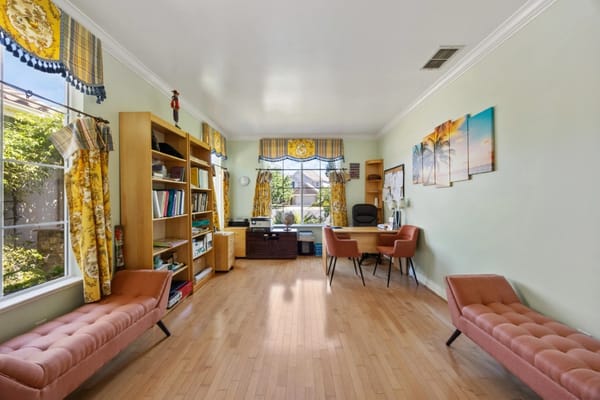 Bright activity room with seating and bookshelves
