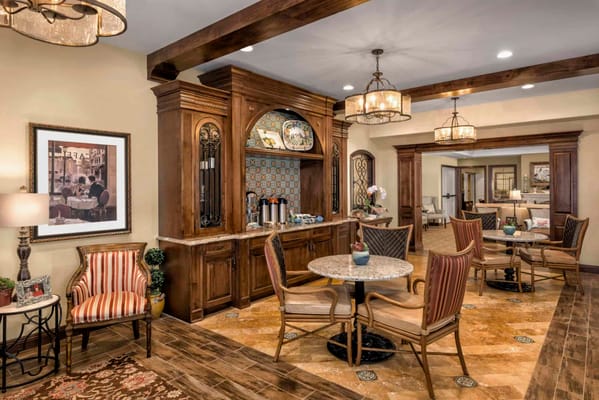 Cozy common area in a senior living facility with dining space