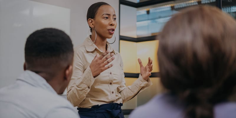 Staff member engaging with residents in an activity setting