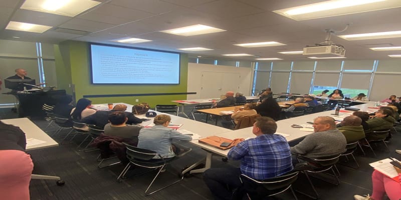 Residents engaged in a group session in a classroom setting