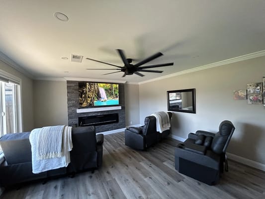 A cozy common area with seating and a fireplace