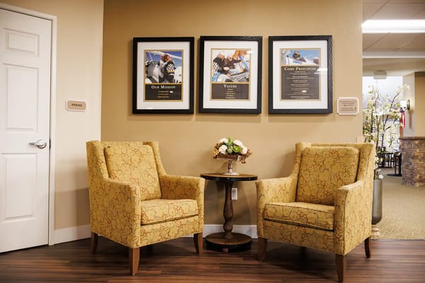 Cozy seating area with framed mission and values