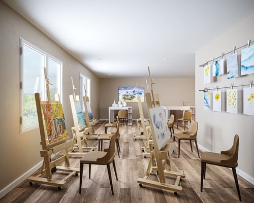 Art therapy room with easels and paintings
