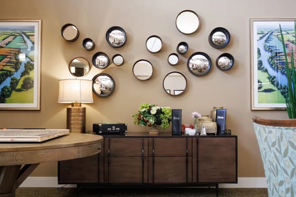 Interior common area with decorative mirrors and flowers