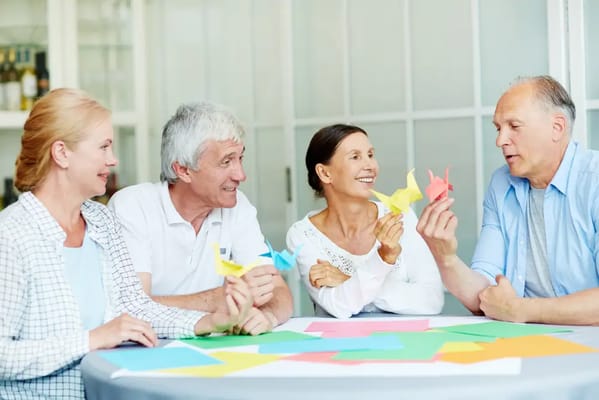 Residents engaging in a crafting activity at a table