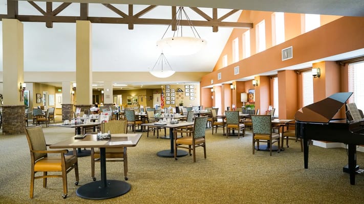 Bright dining room with tables and chairs