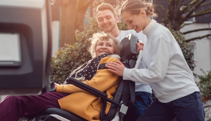 Residents enjoying time outdoors with staff