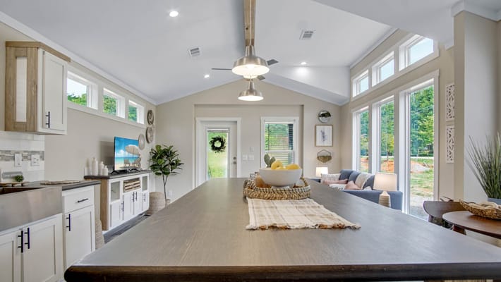 Bright common area with modern decor and large windows