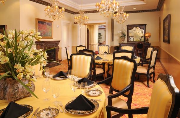 Elegant dining room with a set table and floral centerpiece