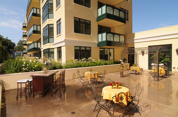 Outdoor patio with tables and seating at the condominium
