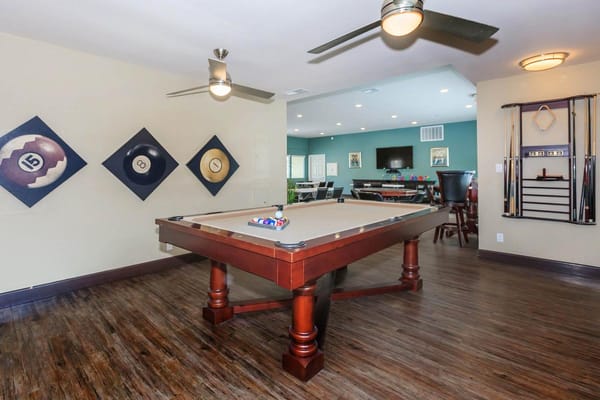 Interior game room with a billiards table