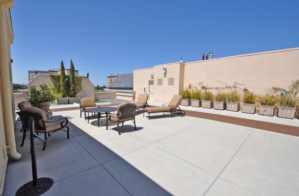 Outdoor seating area with patio furniture and gardens