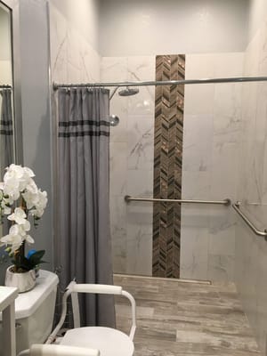 Accessible bathroom with grab bars and modern fixtures