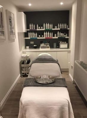 Bright spa room with skincare products displayed