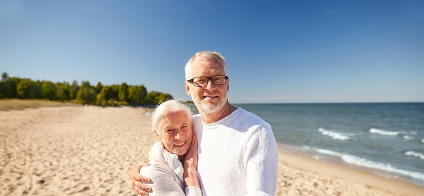 Couple enjoying a sunny day on the beach