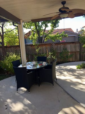 Outdoor dining area with table and chairs