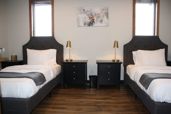 Cozy shared bedroom with two beds and lamps