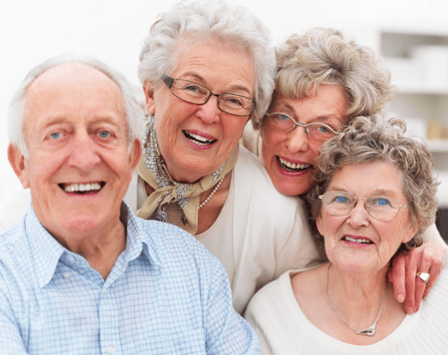 Four smiling seniors enjoying each other's company