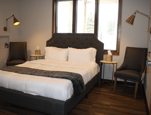 A well-furnished private resident room with a bed and furniture