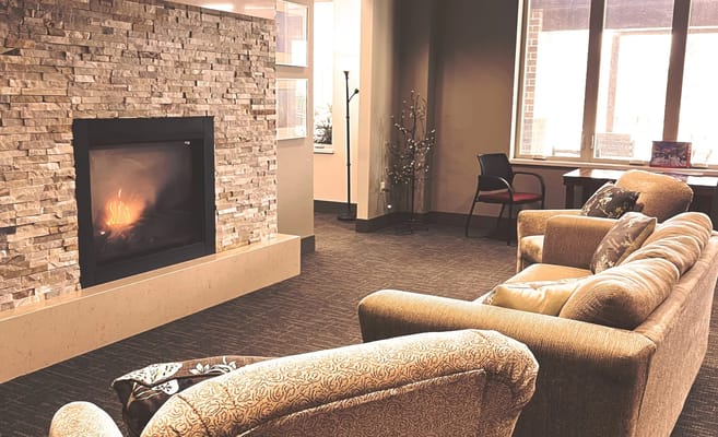 Cozy common area with a fireplace and seating